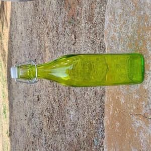 (1) Green Glass Bottle with a closable lid